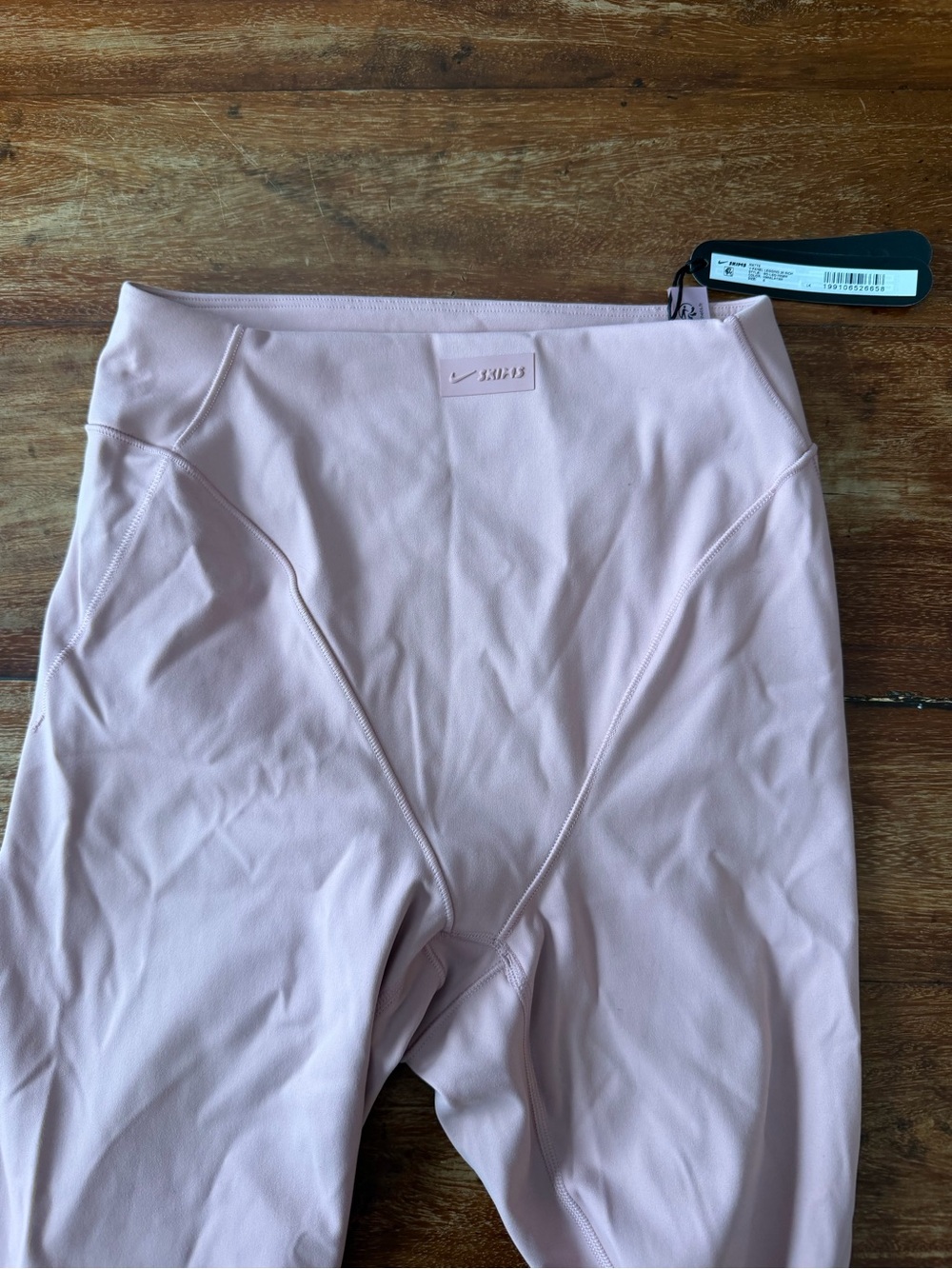 SKIMS x Nike pink v-panel leggings